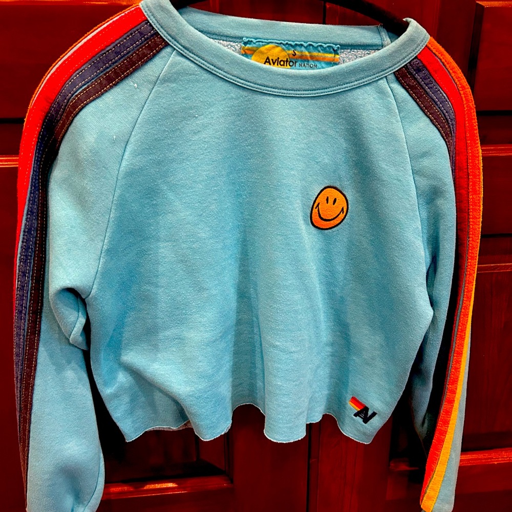 Aviator Nation turquoise sweatshirt with smiley face